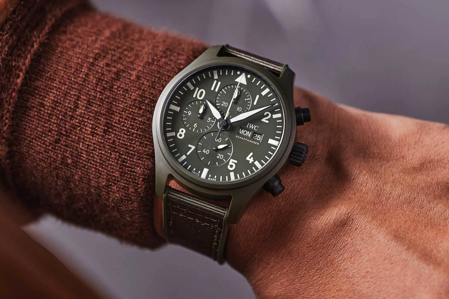 Close-up of an IWC pilot watch with a ceramic or titanium case highlighting its functional design and durable materials