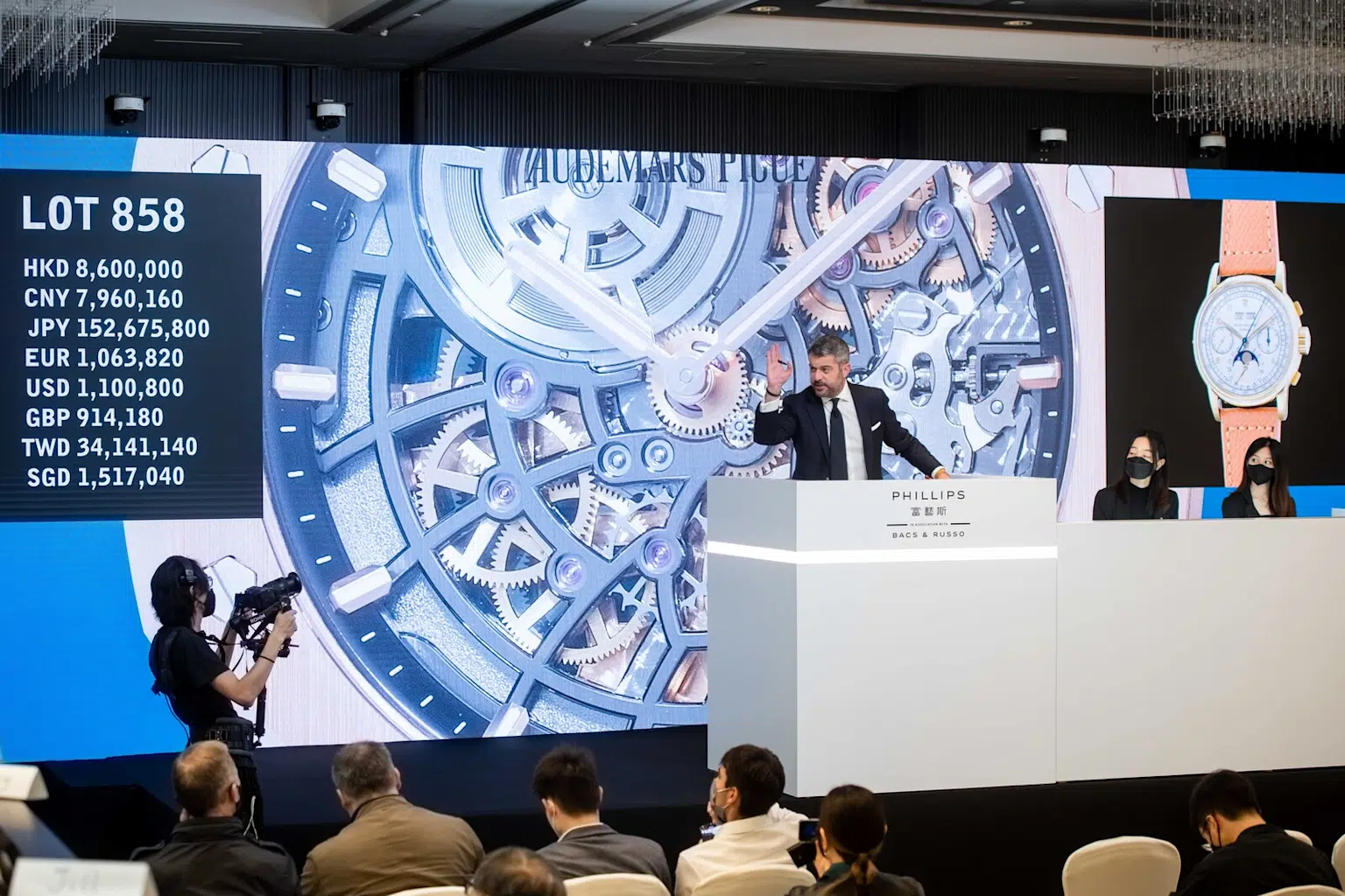 Luxury watch auction at Phillips featuring detailed Audemars Piguet watch display and multi-currency bidding for lot 858