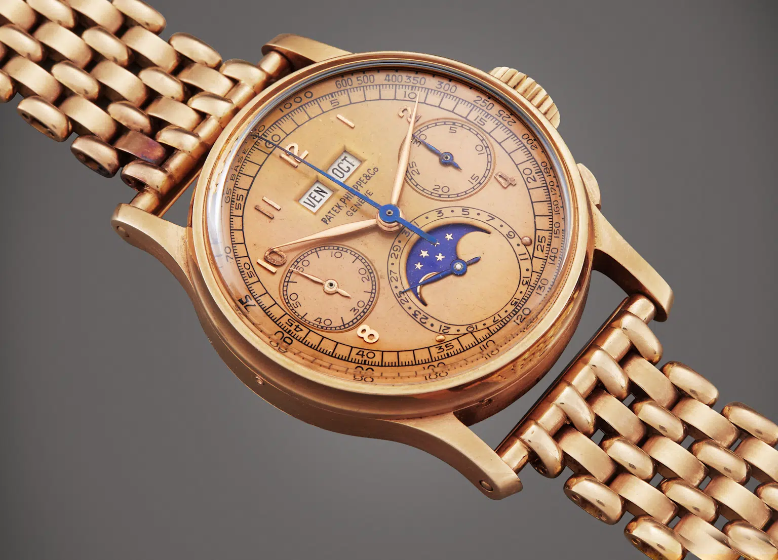 Rose gold Patek Philippe 1518 vintage watch with moon phase and chronograph features, an iconic limited-edition model often seen at high-profile auctions