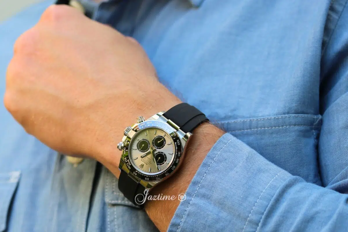 Rolex Daytona in white gold with sporty black Oysterflex bracelet, showcasing a modern luxury chronograph style