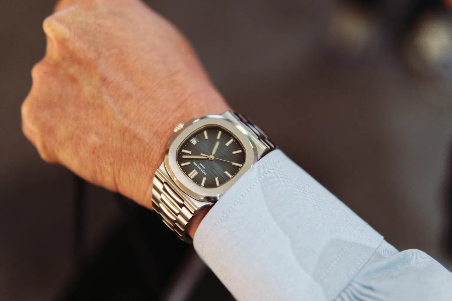 Patek Philippe Nautilus 5711 on wrist, showcasing the iconic steel design and sophisticated dial of the luxury watch