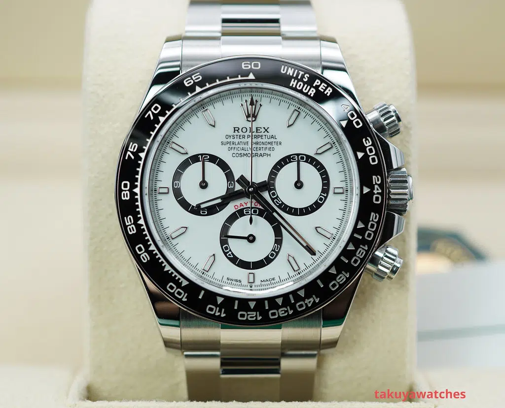 Rolex Daytona 126500LN with white dial and black ceramic bezel, showcasing modern design and chronograph functions