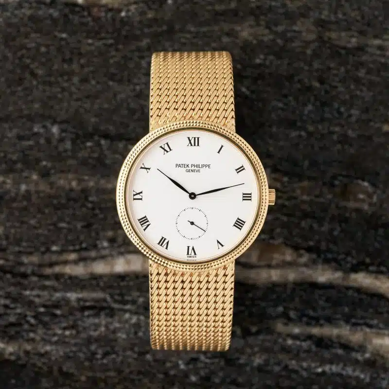 Patek Philippe Calatrava 3919J yellow gold dress watch with mesh bracelet and Roman numeral dial